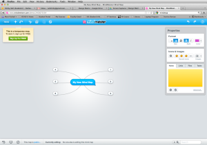 Grey screen with a blue box surrounded by small white boxes to create a blank mind map